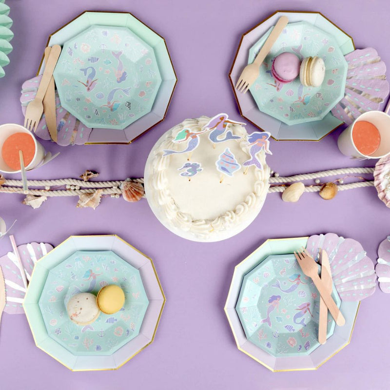 Mermaid party table with seashell napkins and ocean theme decor