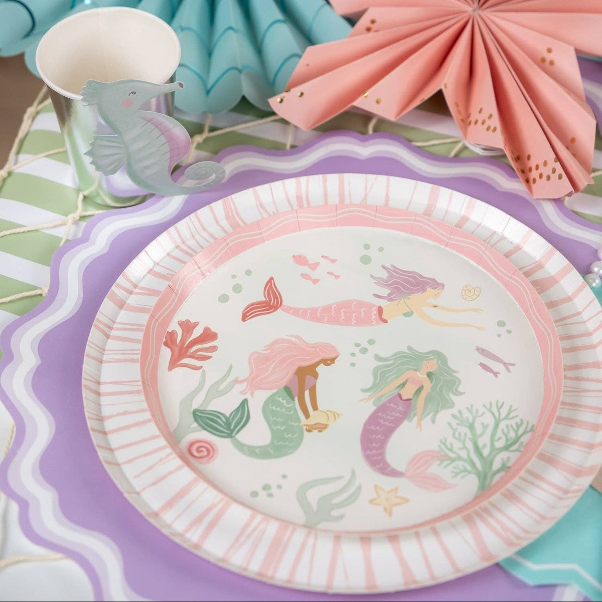 mermaid themed plate with lavender placemat and ocean party decor