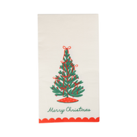 Cream paper dinner napkin with a red and green Christmas tree, "Merry Christmas" lettering, and a red scalloped edge.