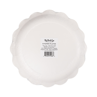 Back of a pack of 8 scalloped Christmas paper plates in clear packaging