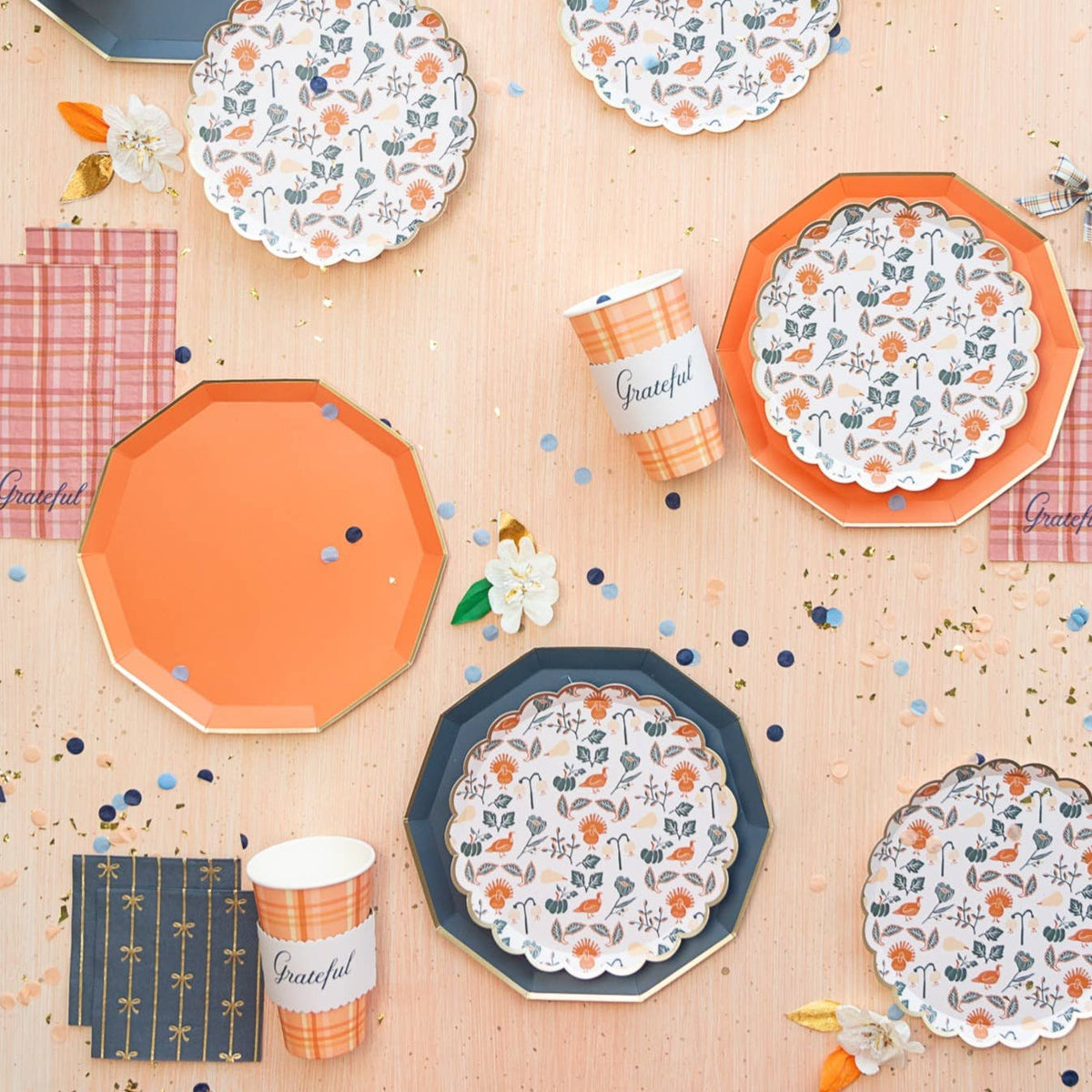 Small navy cocktail napkins displayed with matching tableware