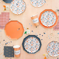 Small navy cocktail napkins displayed with matching tableware