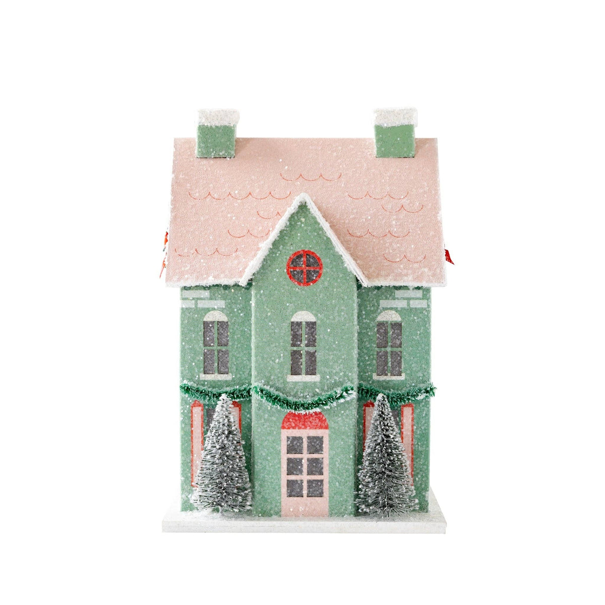 Front view of a mint Christmas paper house with a pink roof on a white background
