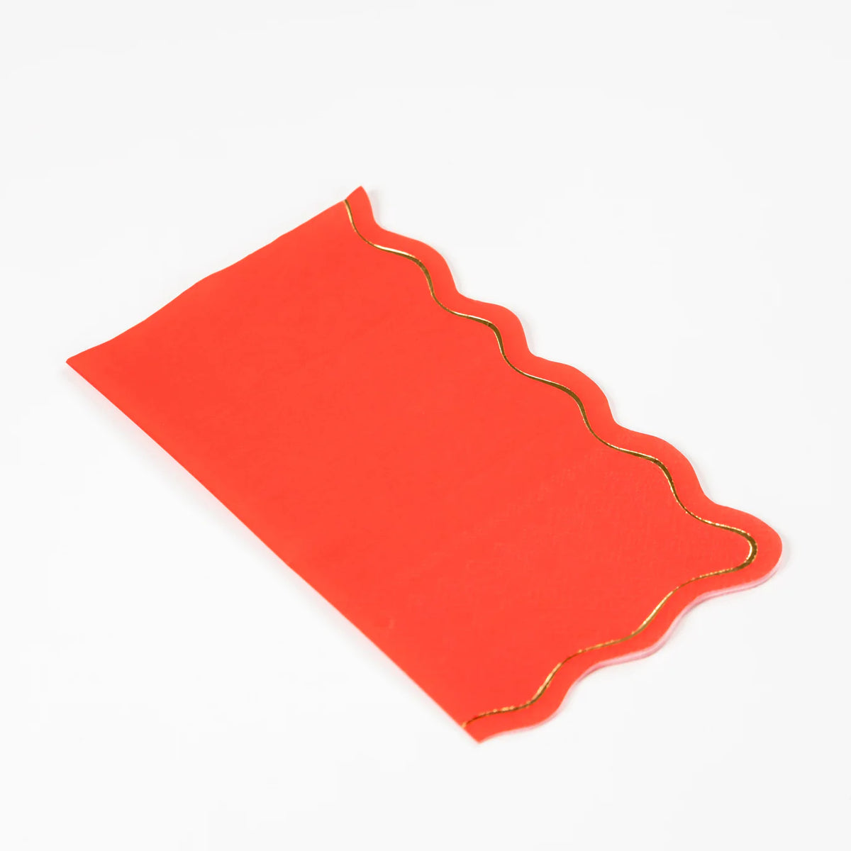Classic red guest towel with gold scalloped border, angled view.