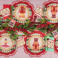 Overhead table with nutcracker plates and mixed color guest towels at each setting.