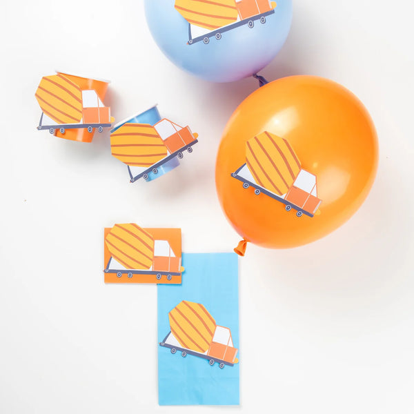 Orange and blue balloons and cups decorated with cement truck accent stickers.
