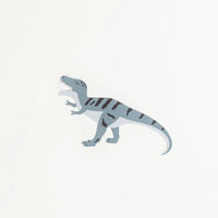 Gray T-Rex accent sticker on white background, side view.