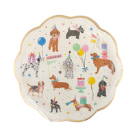 Front view of scalloped dog party plate with puppies, balloons, cakes, and gold rim.