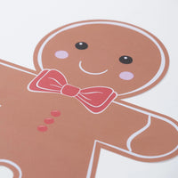 Gingerbread head and upper body with bow tie and icing outlines on white background.