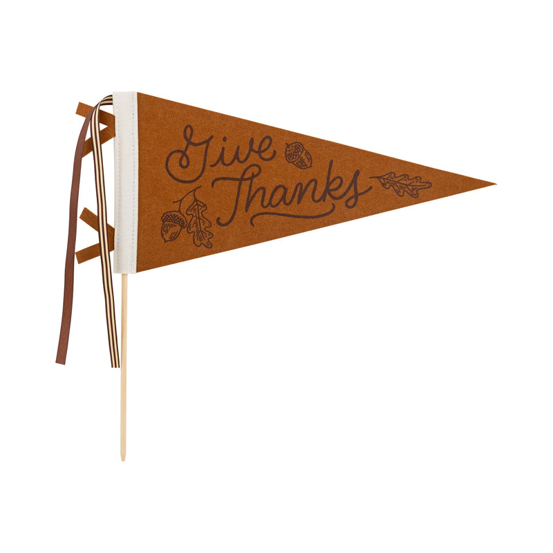 Isolated product image of the Give Thanks felt pennant on a 14 inch wood dowel with ribbon tails.