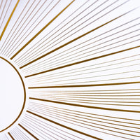 Close crop of gold starburst rays radiating from the center.