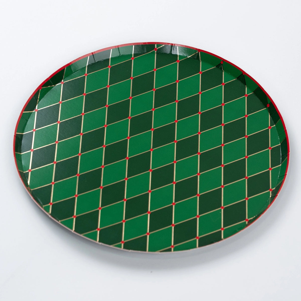 Full view of round green diamond plate with gold lines and red accents.