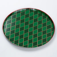 Full view of round green diamond plate with gold lines and red accents.