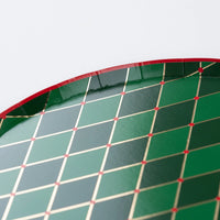 Detail of red rim and gold grid on the green diamond plate.