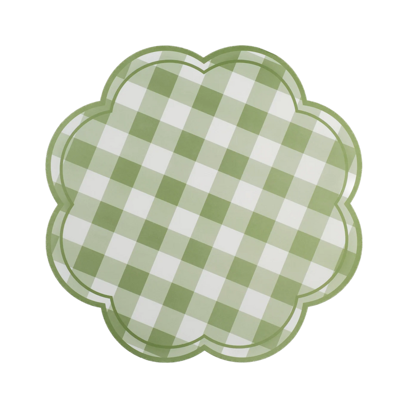 Isolated green gingham scalloped paper placemat on black background.