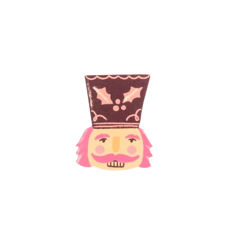 Isolated nutcracker face accent sticker on white background, front view.