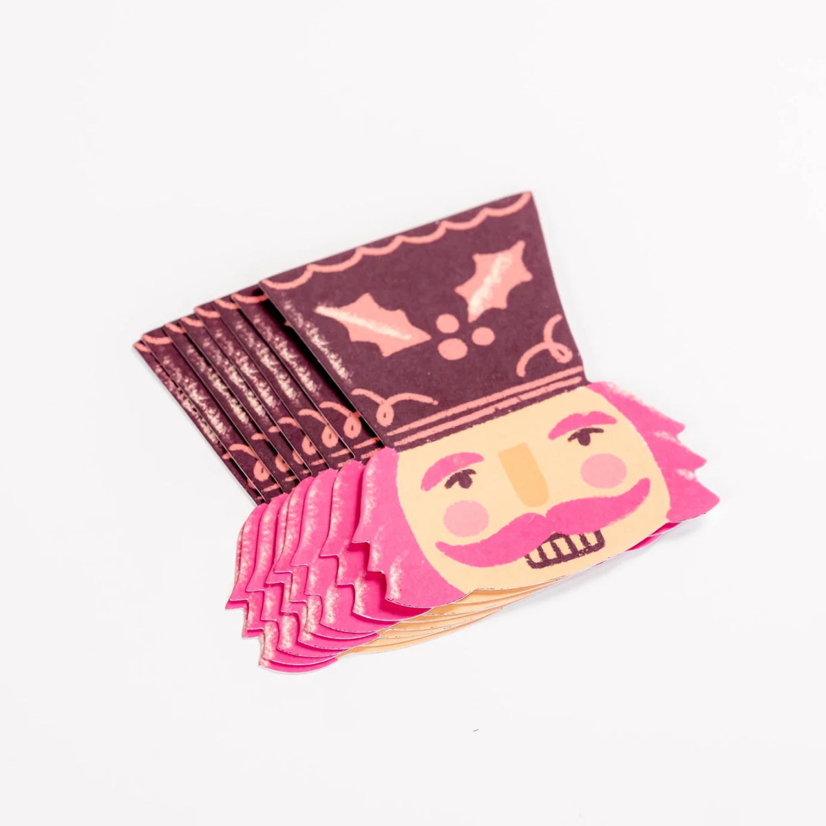 Stack of nutcracker face accent stickers showing the die cut shape.