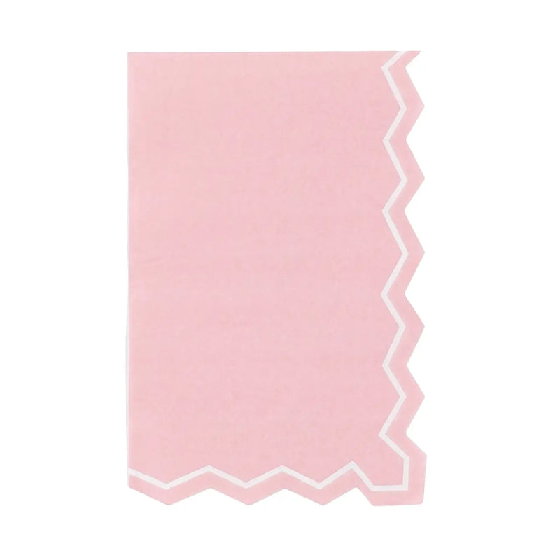 Pink guest towel with white zigzag scalloped edge on right side, flat lay on white background.
