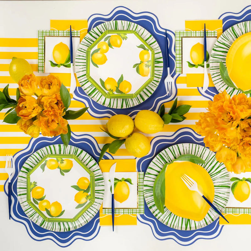Lemon themed tablescape using green Radiance rim plates with blue placemats.