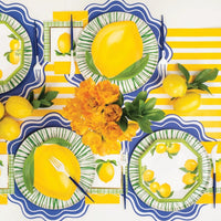 Overhead lemon table with yellow striped runner and green Radiance plates.