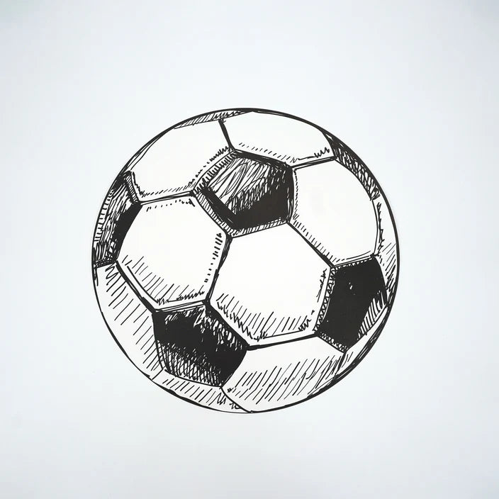 Single round soccer ball paper placemat photographed overhead on white.