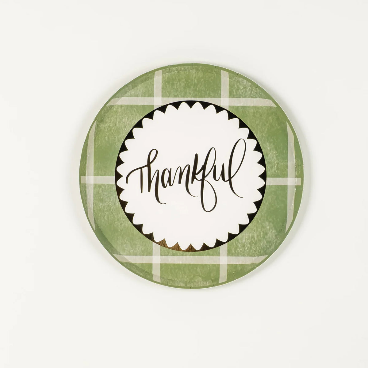 Sage green plaid dessert plate with “thankful” center on white background.