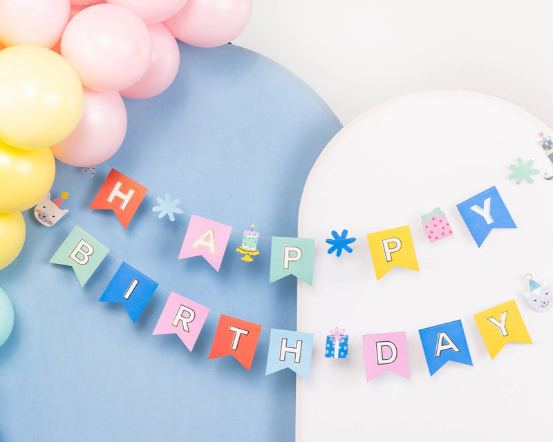 Close-up of assembled pastel Cat Happy Birthday Banner with gift and cake cut-outs
