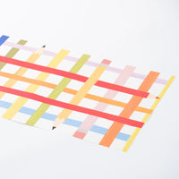 Detail of rainbow pencil pattern printed on a single placemat sheet.