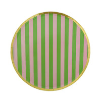 Isolated view of round dinner plate with alternating pink and green stripes and gold rim