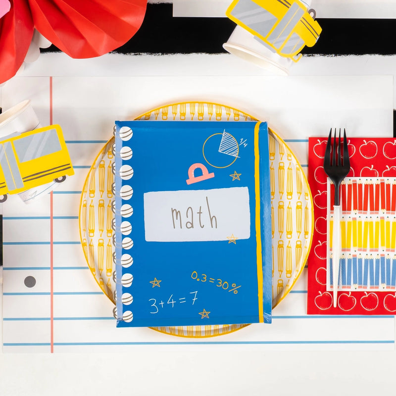 Blue ‘Math’ notebook plate setting with yellow pencil plate and apple guest towel.