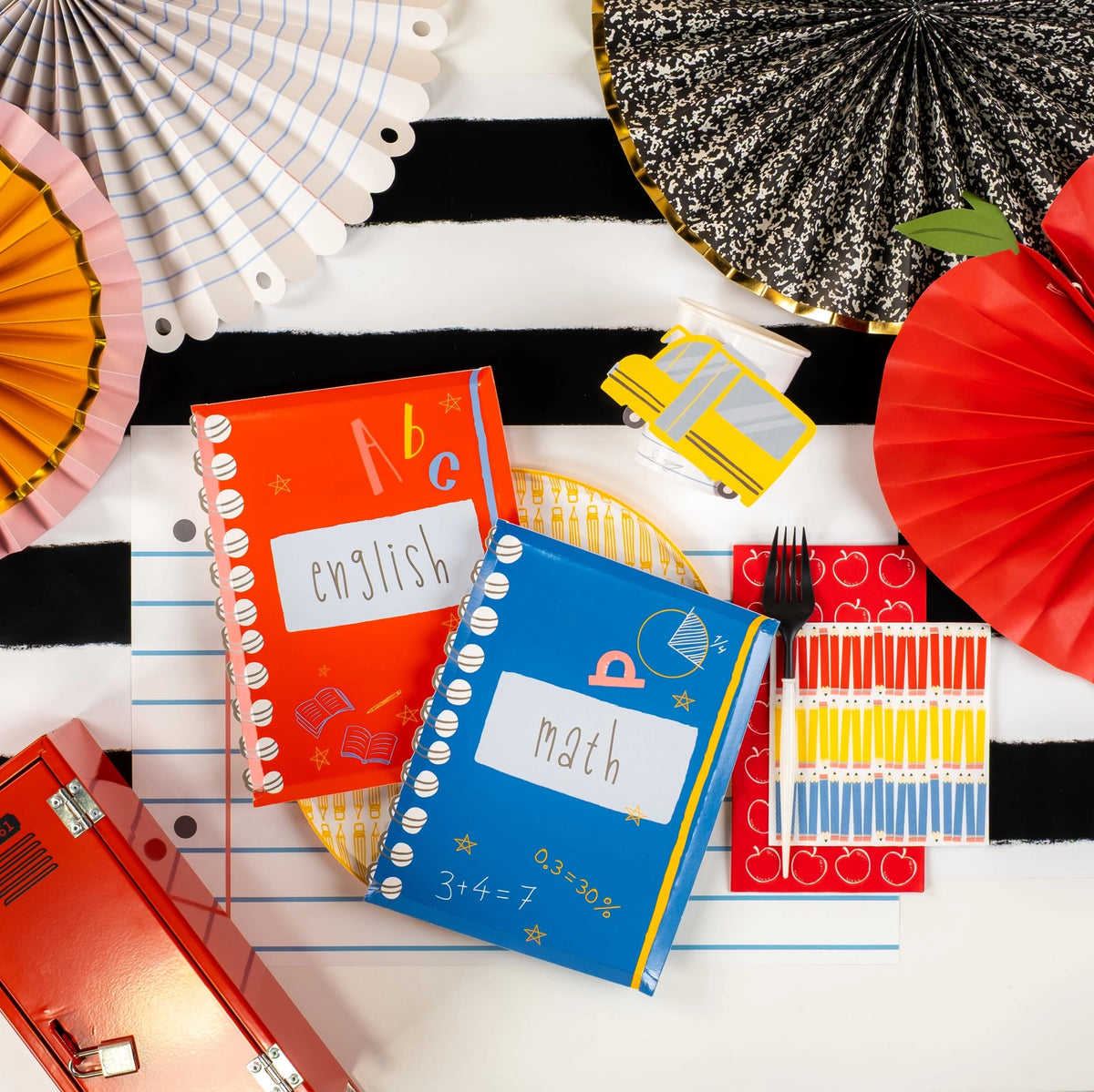 Flat-lay of red and blue notebook plates side by side on white background.