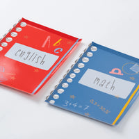 Stack of red notebook plates showing glossy finish and spiral edge.