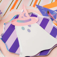 Ghost plate with pink witch hat layered over purple striped plate on a pink and orange runner.