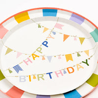 Overhead of dessert plate with Happy Birthday bunting and tassel garlands across the center.