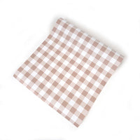 Flat lay of the brown gingham runner showing the full check repeat