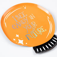 Angled view of the die cut crystal ball plate showing the black stand graphic at the base.