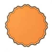 Single orange scalloped paper placemat with layered black and peach border on white background.