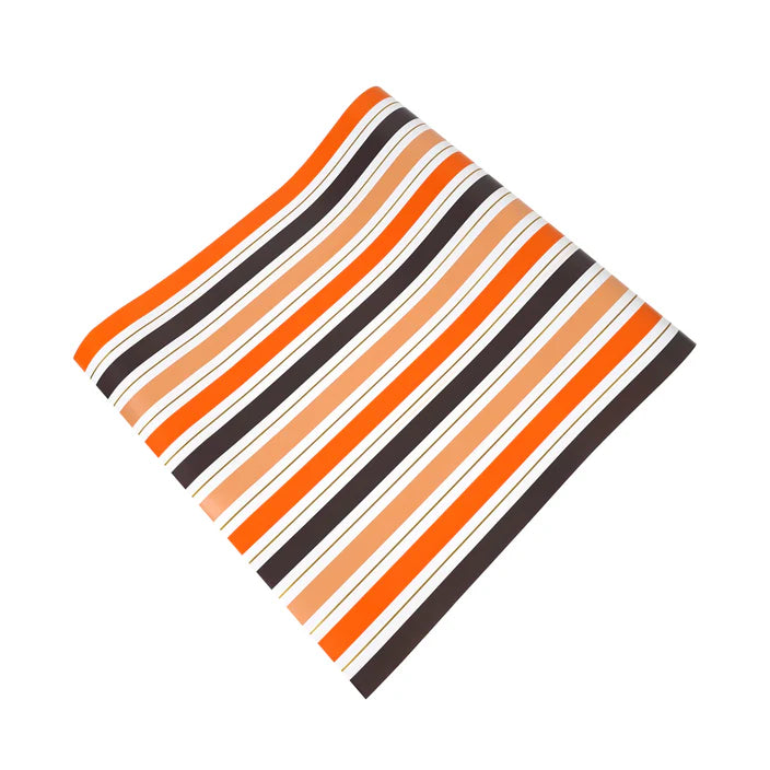 Flat lay of Halloween stripe paper table runner showing full pattern repeat.