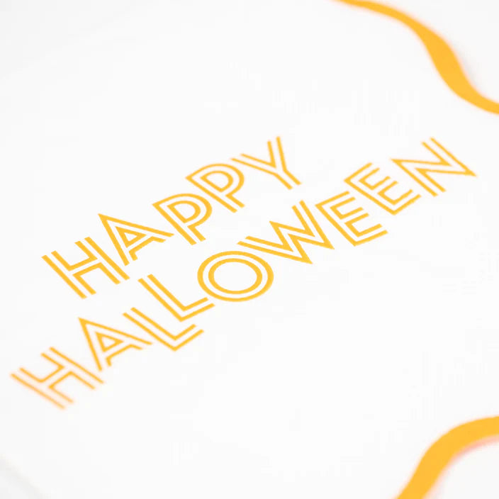 Close up of retro Happy Halloween lettering printed on white napkin.