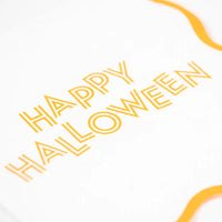 Close up of retro Happy Halloween lettering printed on white napkin.