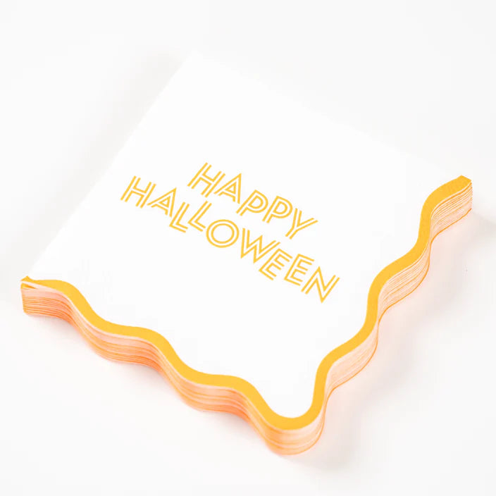 Angled stack of Happy Halloween scalloped cocktail napkins on white background.