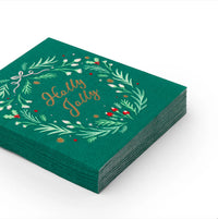 Stack of emerald green cocktail napkins with wreath and “Holly Jolly” script