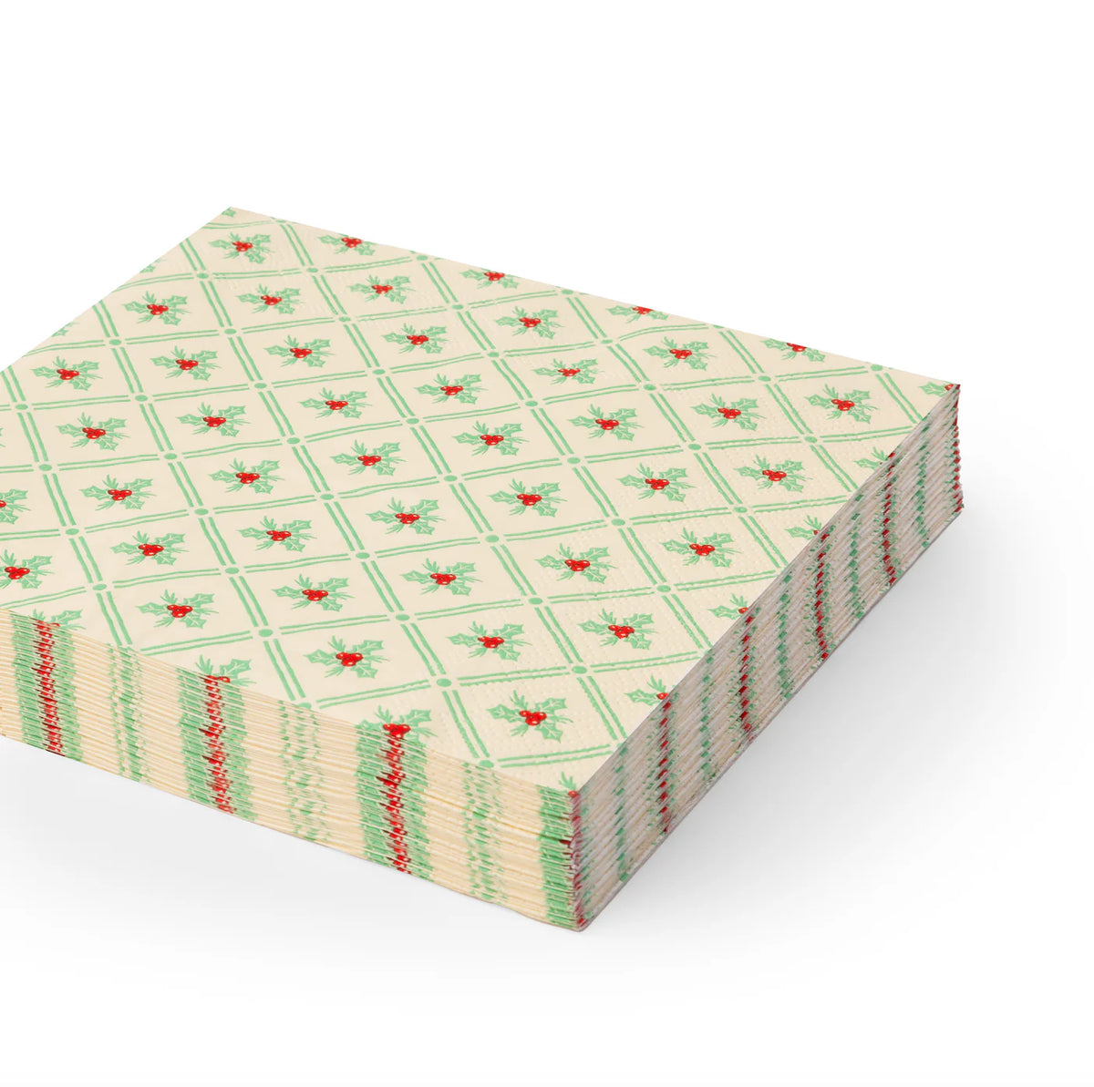 Stack of holly-patterned lunch Christmas paper napkins with green lattice and red berries