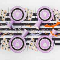 Halloween setup featuring lilac dinner plates with ghost dessert plates