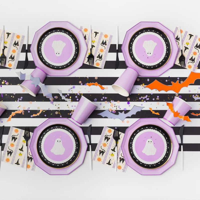 Halloween setup featuring lilac dinner plates with ghost dessert plates