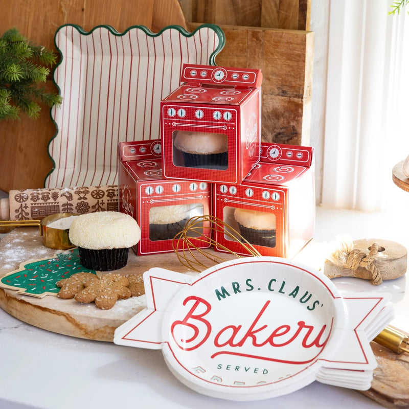 Stacked retro red oven Christmas treat boxes with cupcake windows for cookie exchange kit styling.