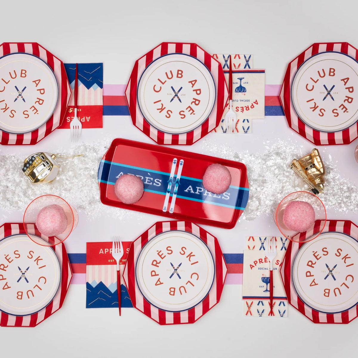 Après-ski tablescape featuring pink and red cabana Christmas plates in 10.75" decagon shape