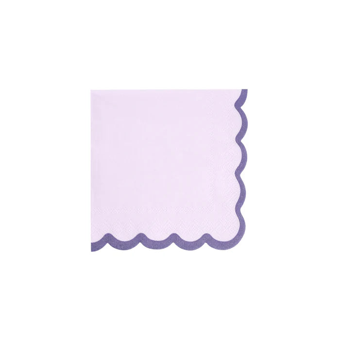 Single lilac cocktail napkin with dark purple scalloped border on white background.