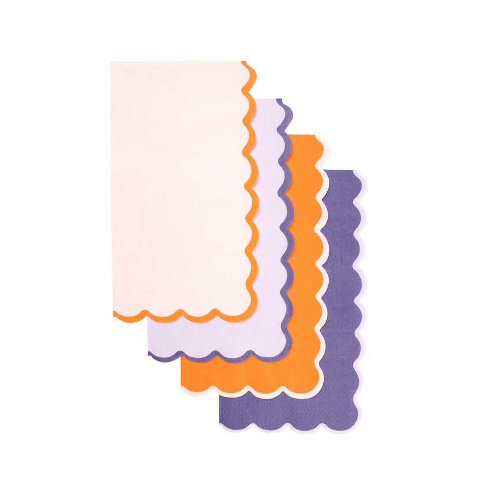 Four scalloped guest towels fanned vertically, showing all colorways and contrast borders.