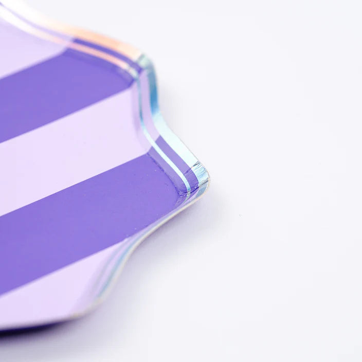 Corner macro of purple striped dinner plate with iridescent rim detail.
